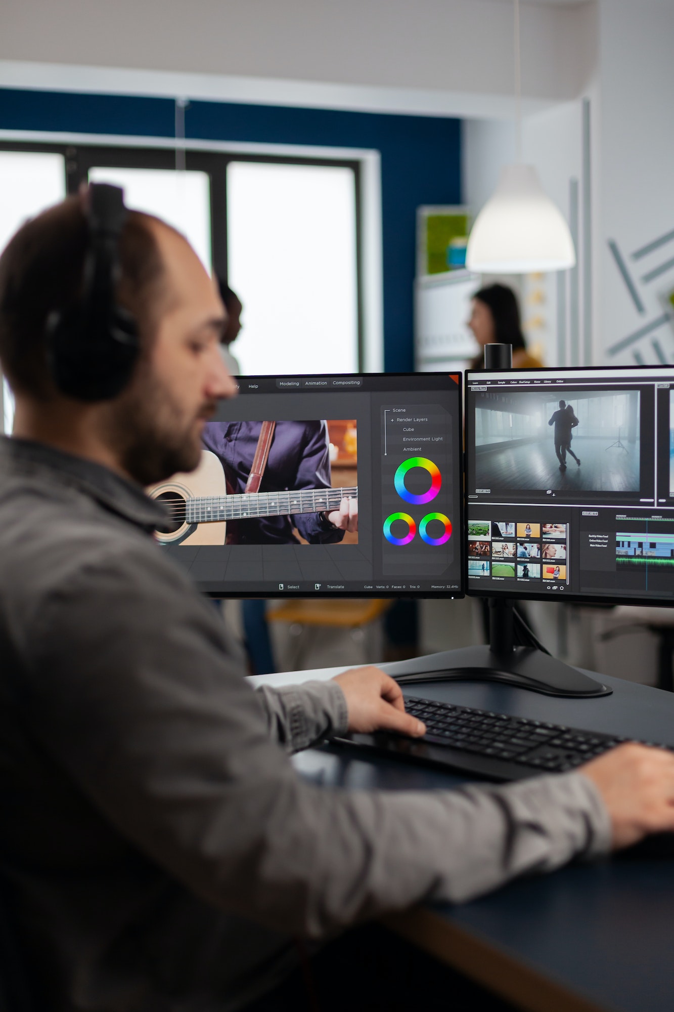 Graphic video production working on pc with two displays editing video