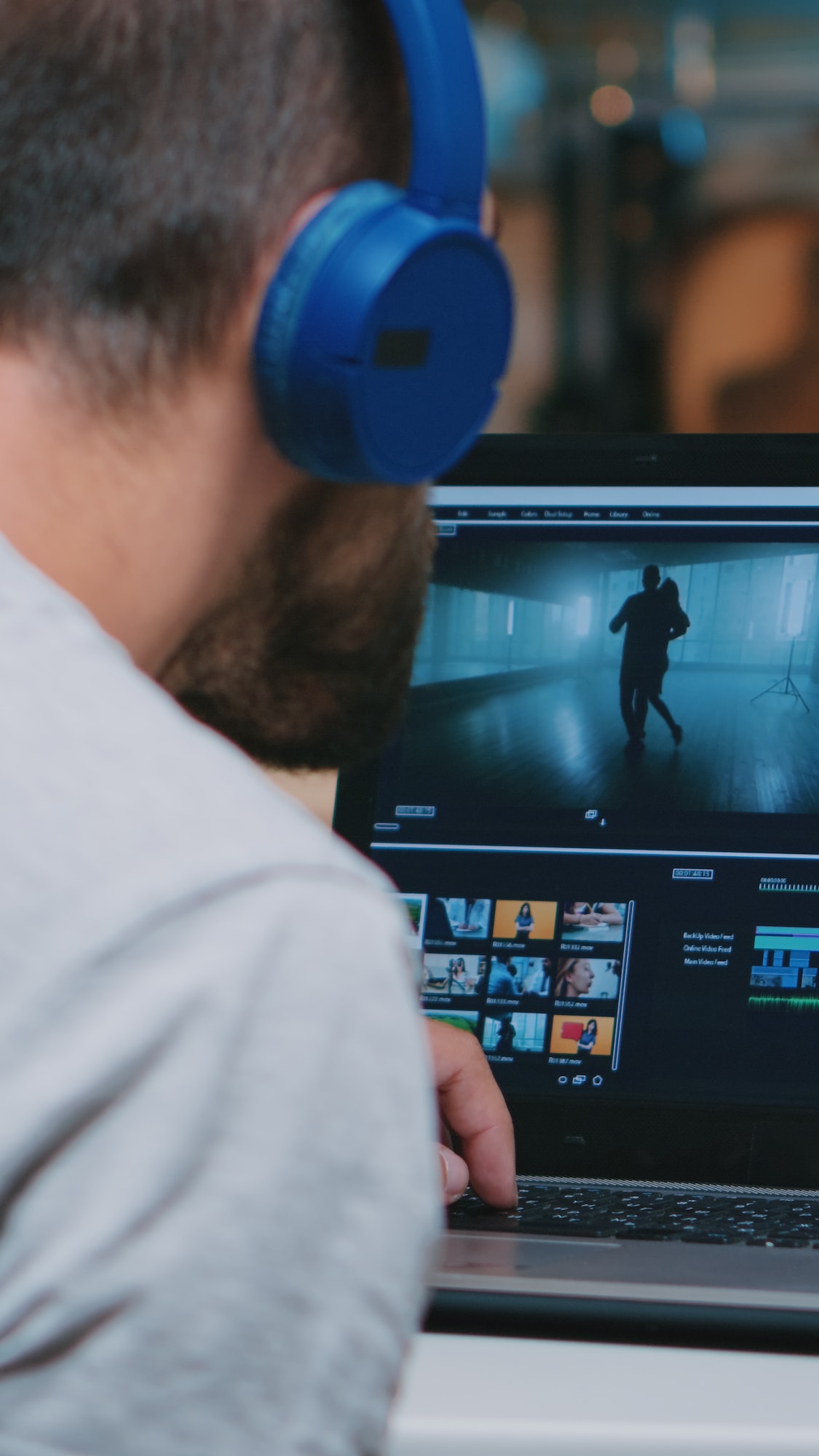 Videographer working remotely editing video footage